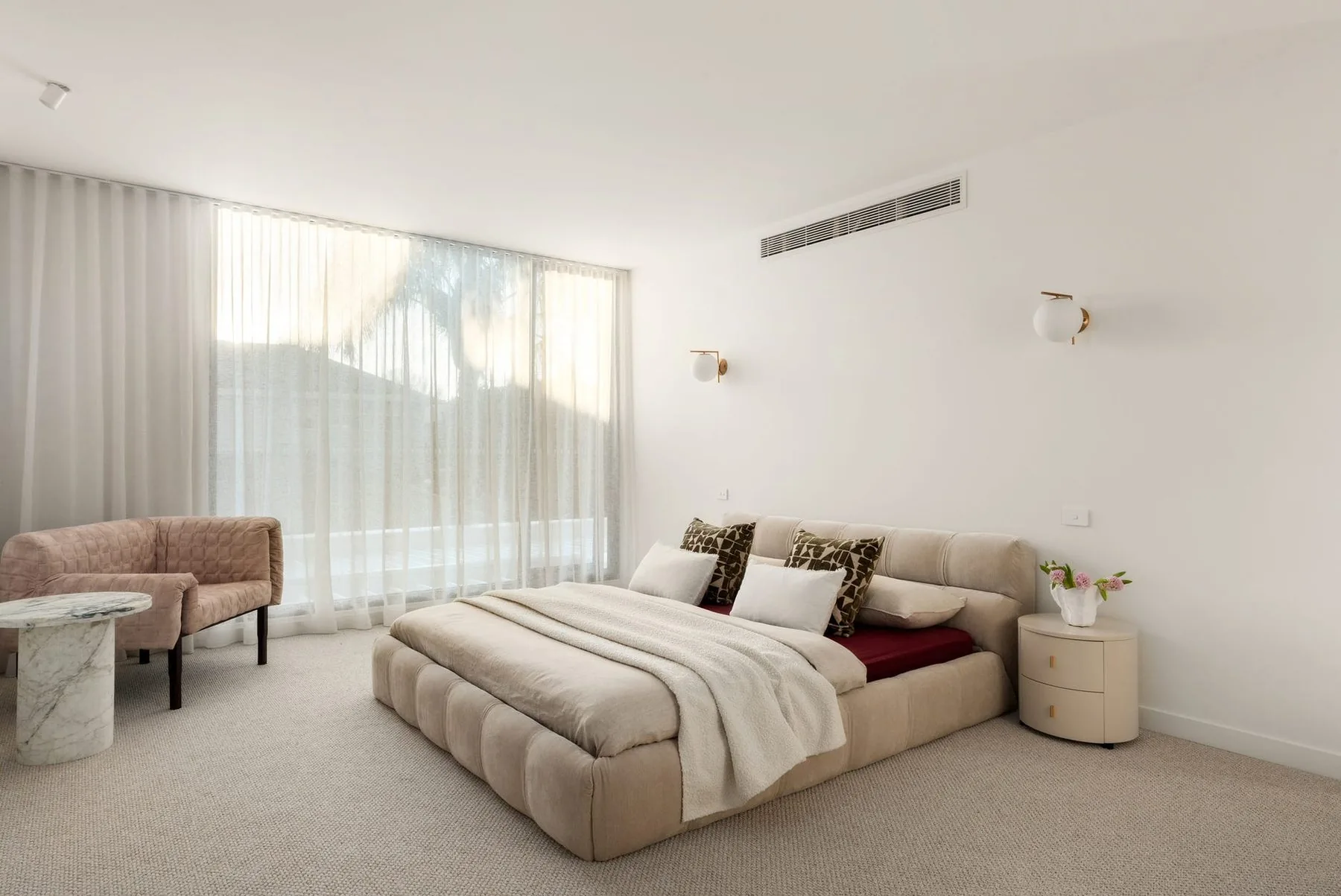 Bedroom with floor to ceiling sheer curtains