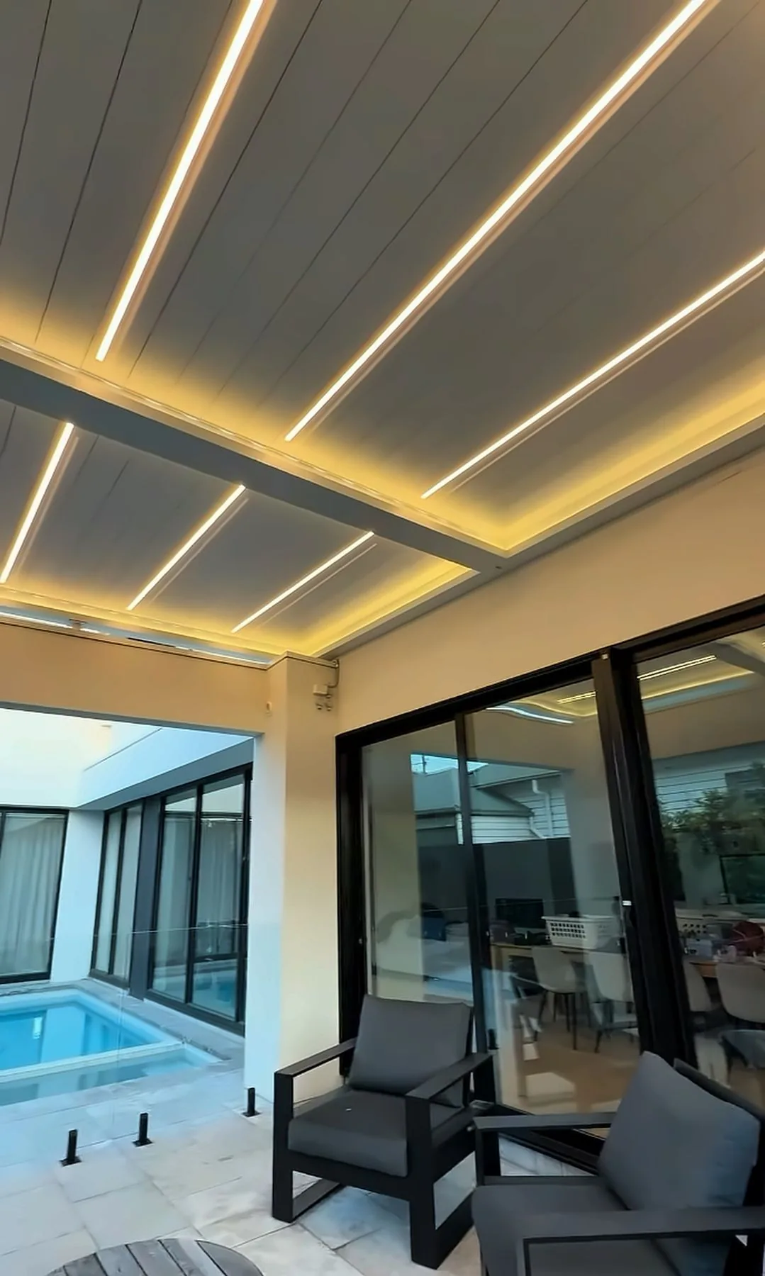 Louvered roof with LED lighting over a patio